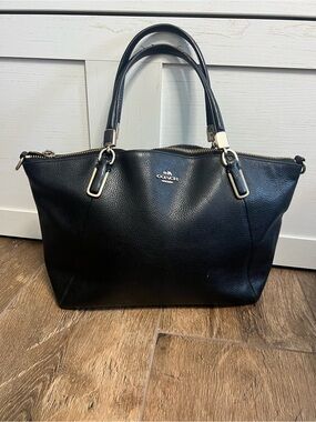 Coach Small Kelsey Satchel in Black Pebbled Leather with gold-tone hardware.